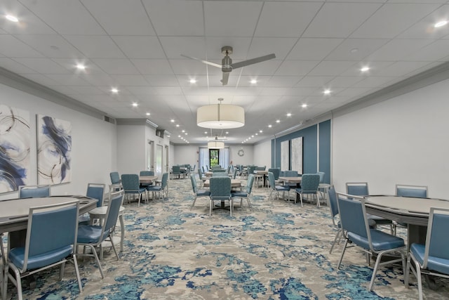 carpeted dining area featuring a ceiling fan, recessed lighting, crown molding, and visible vents