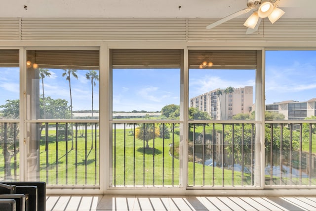 unfurnished sunroom with a water view