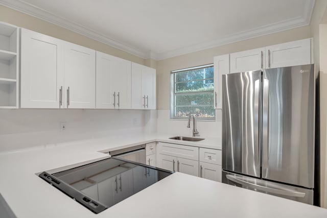 kitchen with white cabinetry, sink, ornamental molding, and appliances with stainless steel finishes