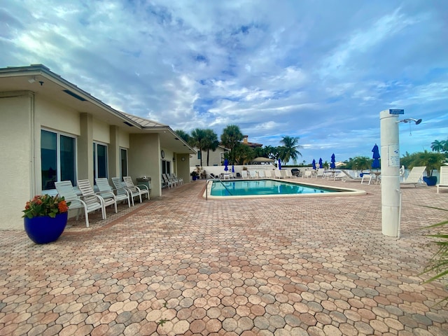 view of swimming pool featuring a patio