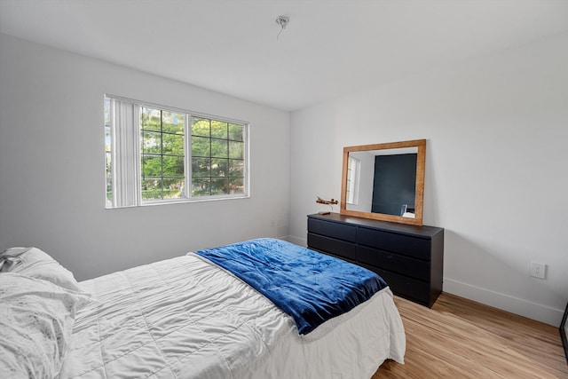 bedroom with light hardwood / wood-style flooring