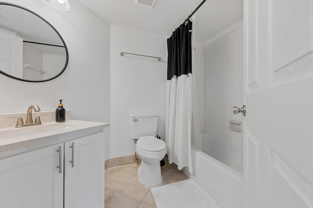 full bathroom featuring vanity, toilet, shower / bath combo with shower curtain, and tile patterned floors