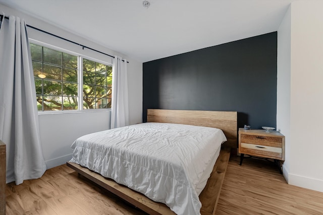 bedroom with light hardwood / wood-style flooring