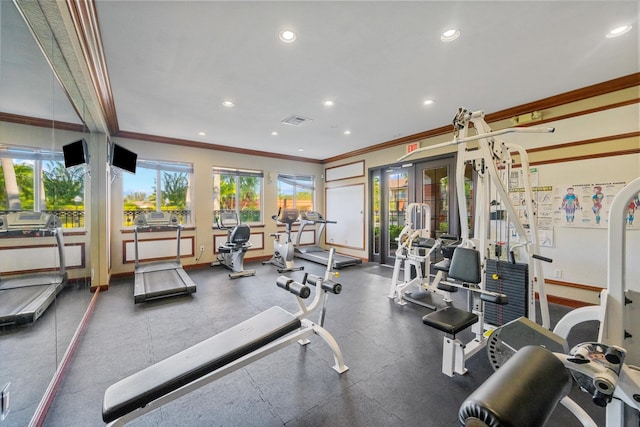 workout area featuring crown molding