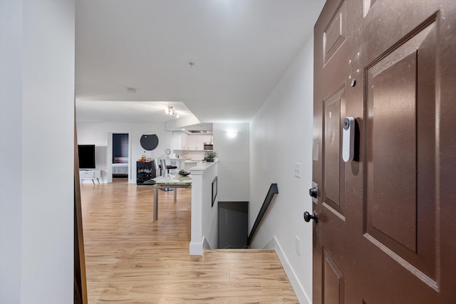 hallway featuring light hardwood / wood-style flooring