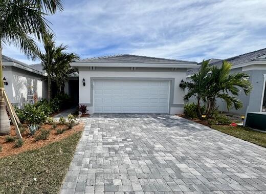 single story home with a garage