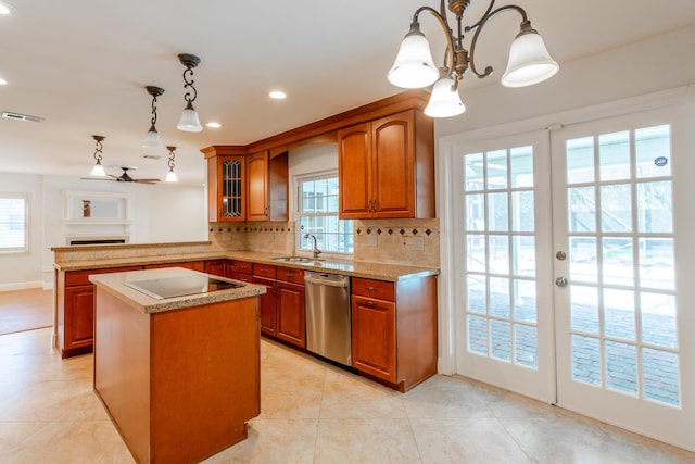 kitchen featuring hanging light fixtures, decorative backsplash, kitchen peninsula, a kitchen island, and dishwasher