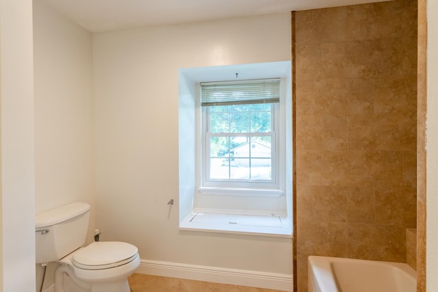 bathroom featuring plus walk in shower, toilet, and tile patterned floors