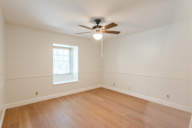 unfurnished room with ceiling fan and light wood-type flooring