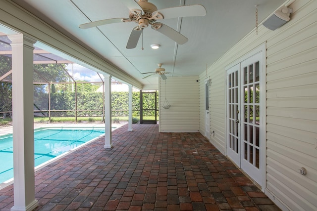 view of pool featuring a lanai, ceiling fan, and a patio area