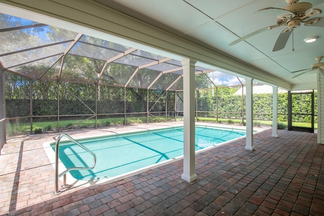 view of pool featuring a lanai, a patio, and ceiling fan