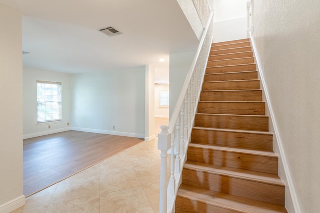 staircase featuring hardwood / wood-style floors