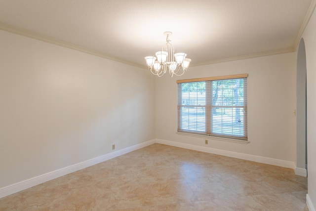 unfurnished room featuring ornamental molding and a notable chandelier