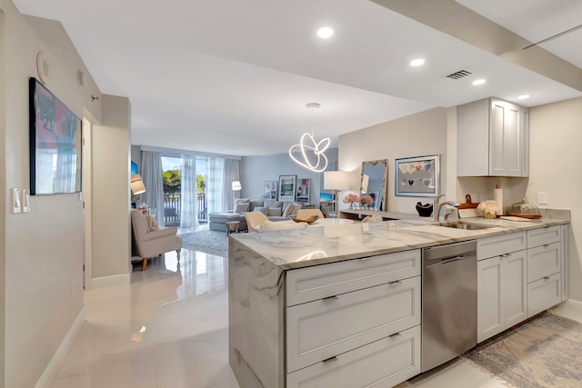 kitchen featuring light stone countertops, sink, an inviting chandelier, stainless steel dishwasher, and white cabinets