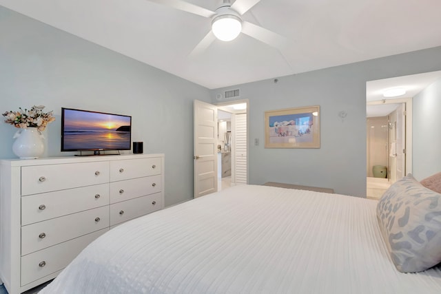 bedroom with ensuite bath and ceiling fan