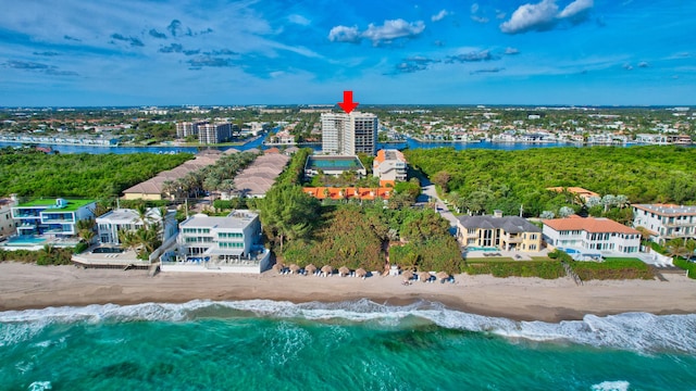 bird's eye view featuring a water view and a view of the beach