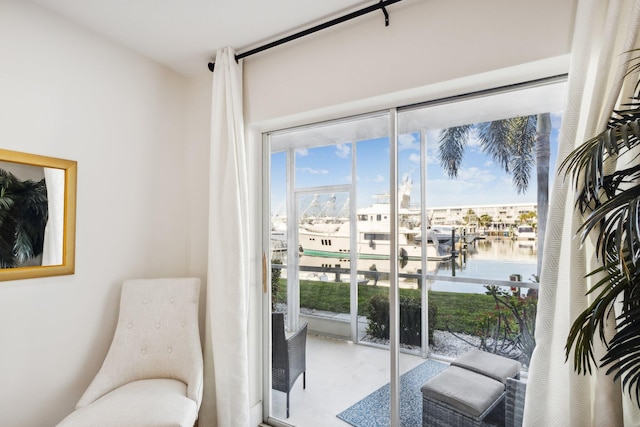 sitting room featuring a water view