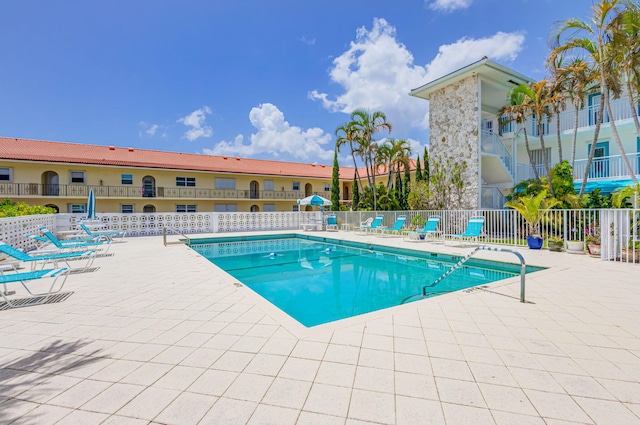 view of swimming pool featuring a patio