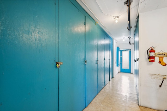 hallway with light tile patterned floors