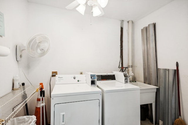 clothes washing area with washer and dryer and ceiling fan