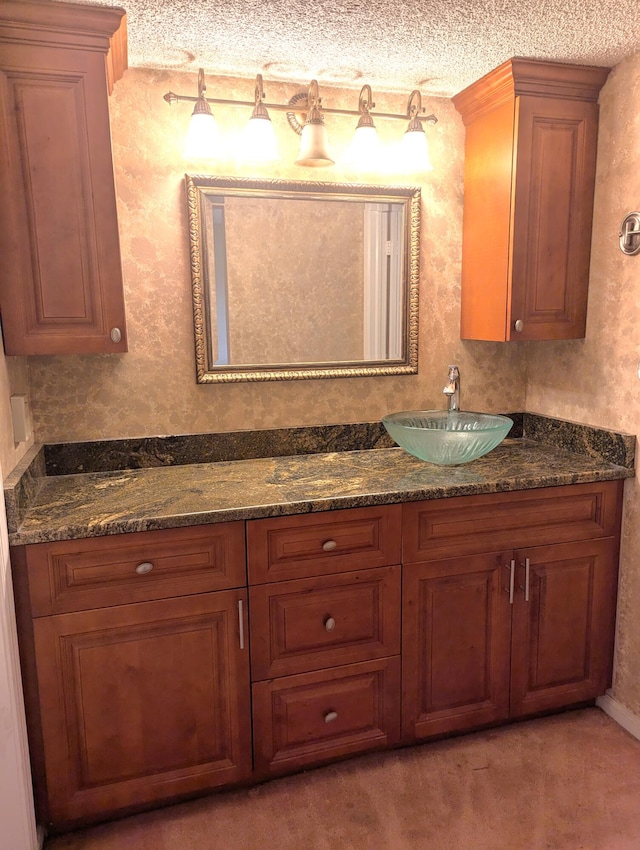 bathroom featuring vanity and a textured ceiling