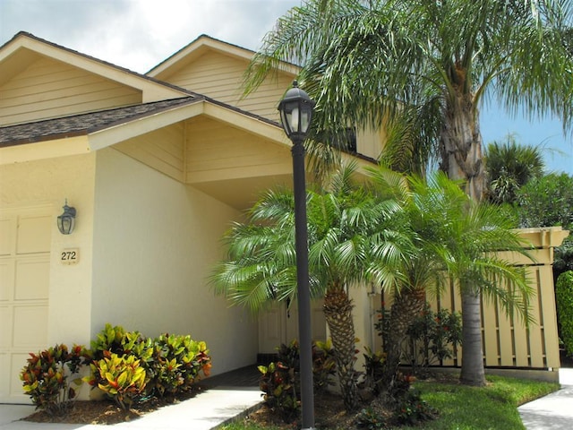 view of side of home featuring a garage