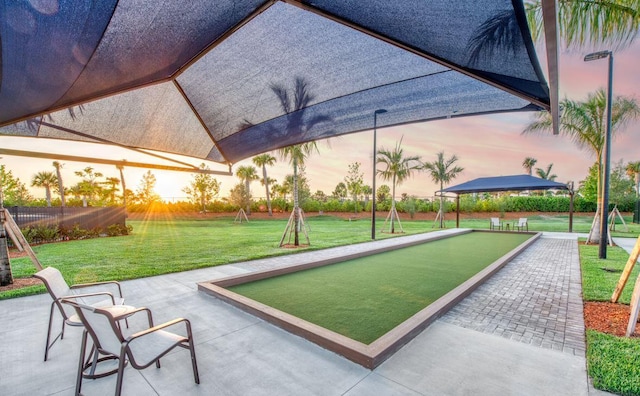 surrounding community featuring a lawn and fence