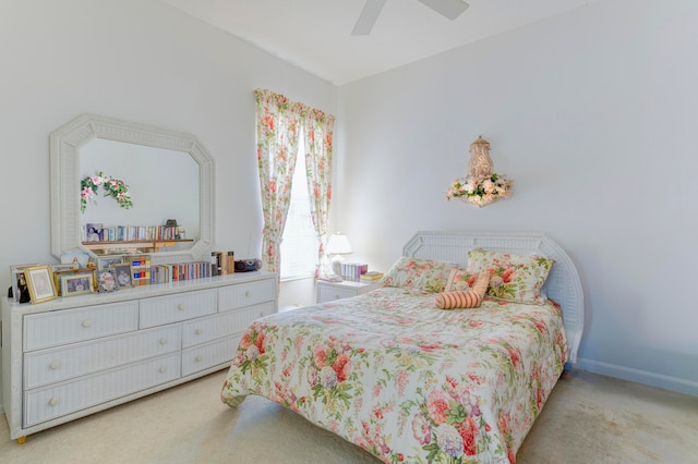 bedroom featuring light carpet and ceiling fan