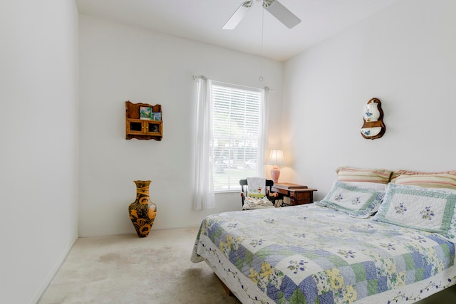 bedroom featuring light carpet and ceiling fan