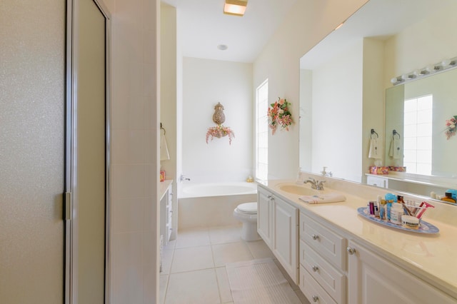 full bathroom with vanity, tile patterned flooring, toilet, and a wealth of natural light