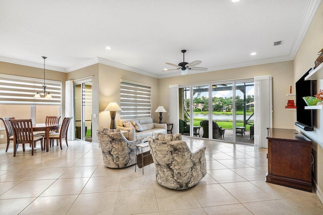 living room with a textured ceiling, crown molding, light tile patterned flooring, and ceiling fan with notable chandelier