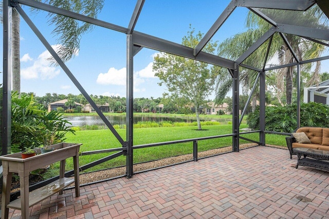 unfurnished sunroom with a water view