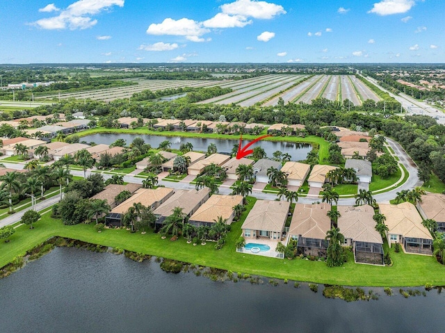 bird's eye view with a water view