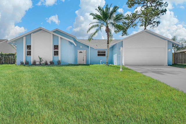 single story home with a garage and a front lawn