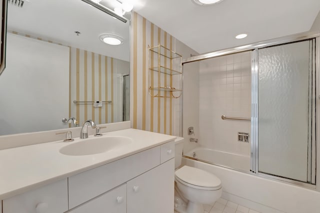 full bathroom with shower / bath combination with glass door, vanity, toilet, and tile patterned floors