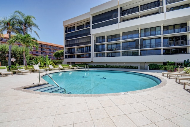 view of swimming pool with a patio area