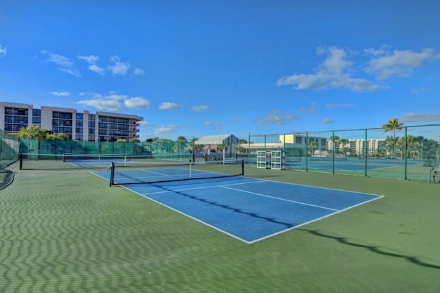 view of tennis court with fence