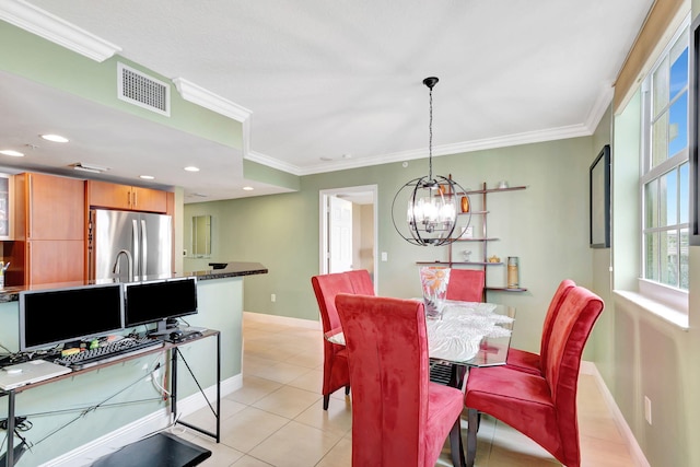 tiled dining space with crown molding and a chandelier