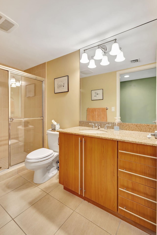 bathroom with walk in shower, vanity, toilet, and tile patterned floors