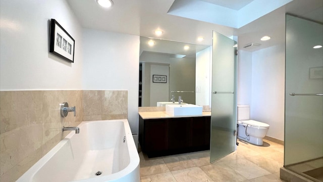 full bathroom with vanity, shower with separate bathtub, and toilet