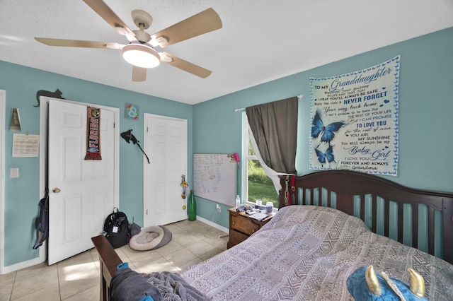 bedroom featuring ceiling fan and light tile patterned floors