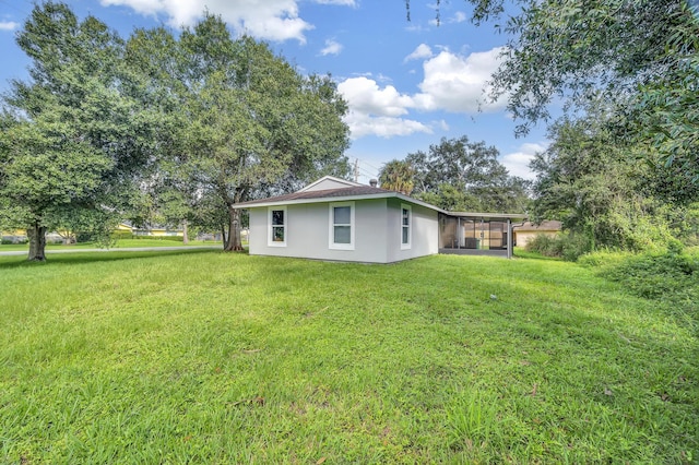 5000 Fort Pierce Blvd, Fort Pierce, FL 34951 - view of grassy yard with a sunroom