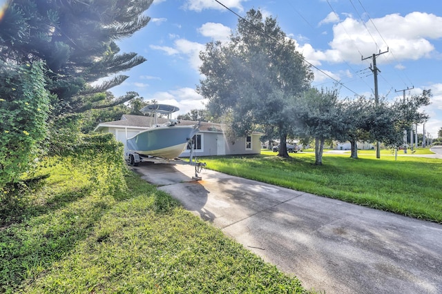 5000 Fort Pierce Blvd, Fort Pierce, FL 34951 - view of front of house featuring driveway and a front yard
