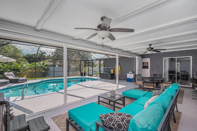 view of swimming pool with outdoor lounge area, a lanai, ceiling fan, and a patio area