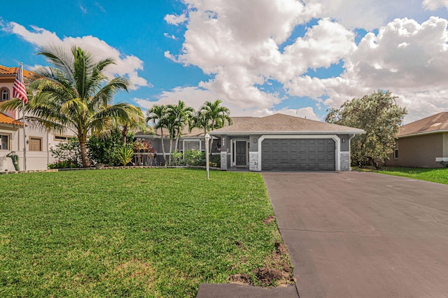 ranch-style house featuring a front lawn and a garage