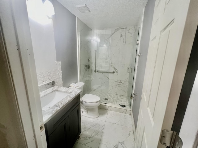 full bathroom featuring marble finish floor, visible vents, toilet, vanity, and a textured ceiling