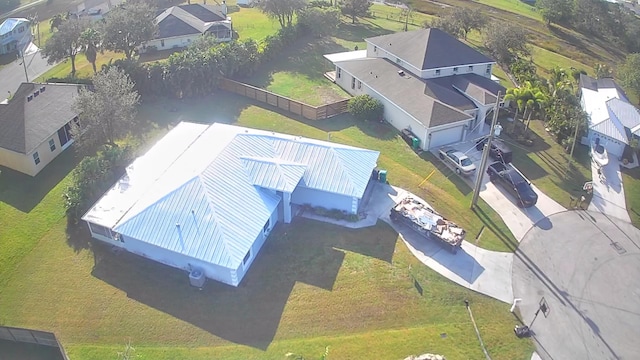 birds eye view of property with a residential view