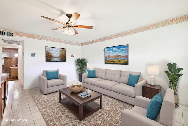 living room with light tile patterned floors and ceiling fan