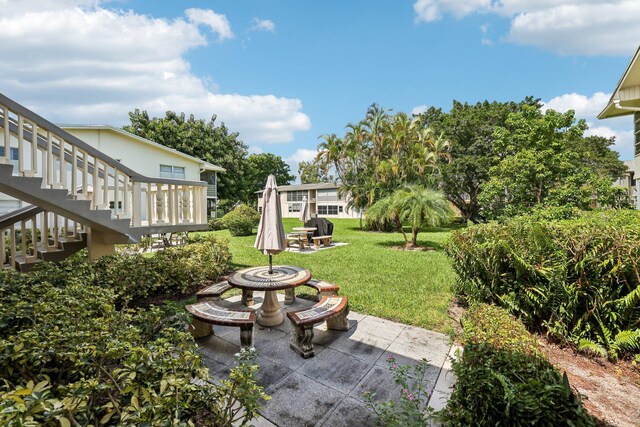 view of yard featuring a patio area and an outdoor fire pit