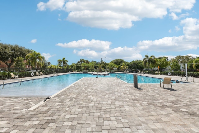 view of swimming pool with a patio area